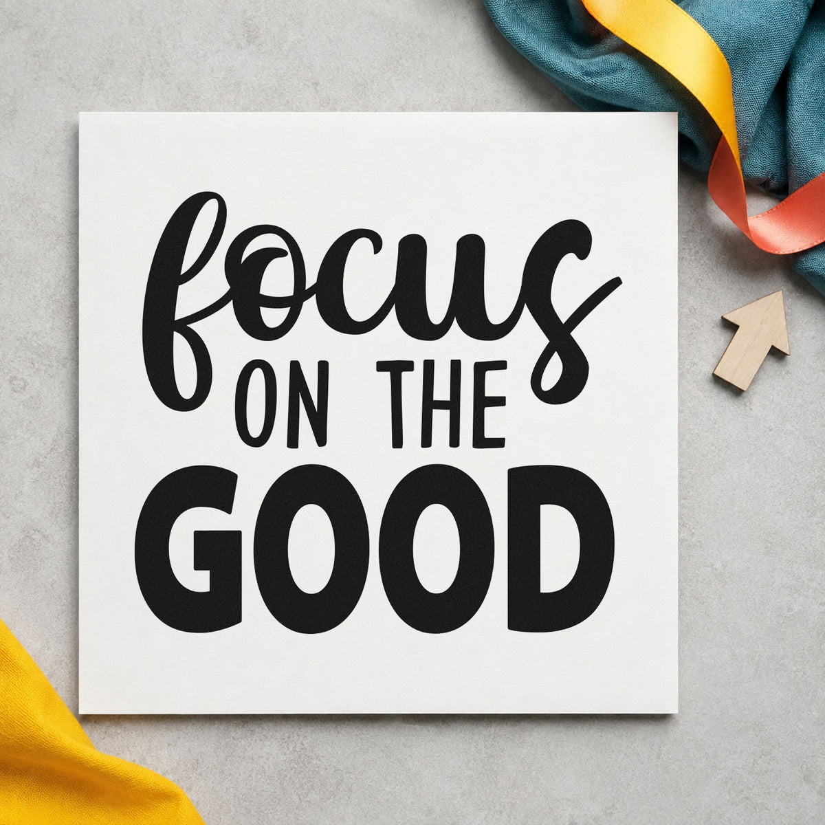 Focus On The Good craft stamp imprint in black ink on a handmade project, one idea being recipe bundle tags.