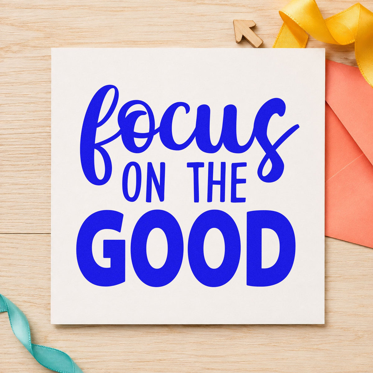 Focus On The Good craft stamp in blue ink on cardstock, an easy option for napkin set printing.