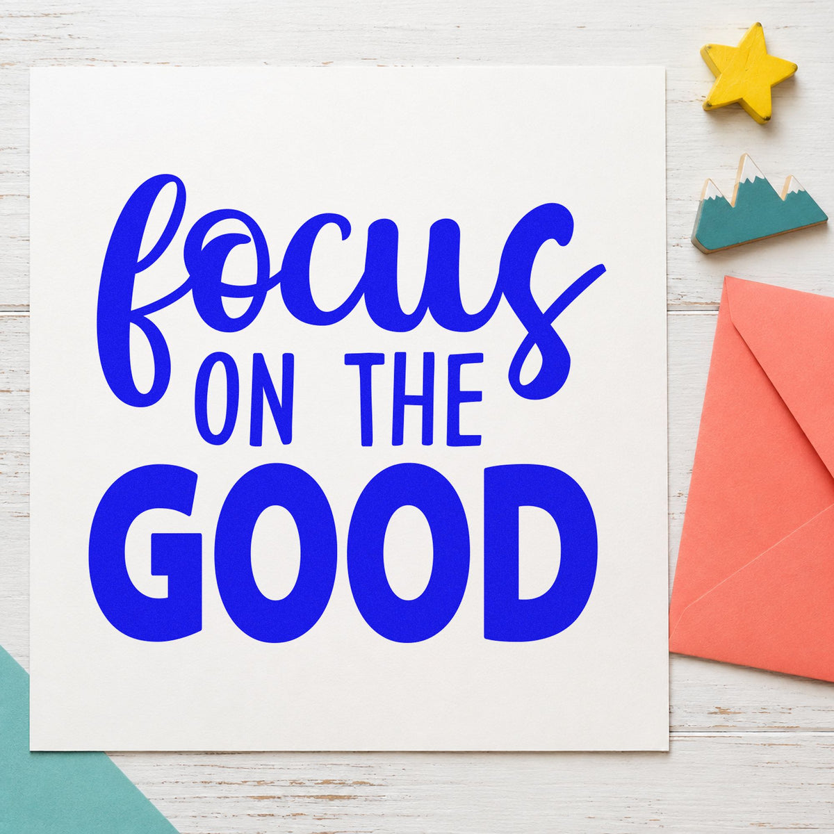 Focus On The Good craft stamp imprinted in blue ink on paper, a design suited to framed dinner nook.