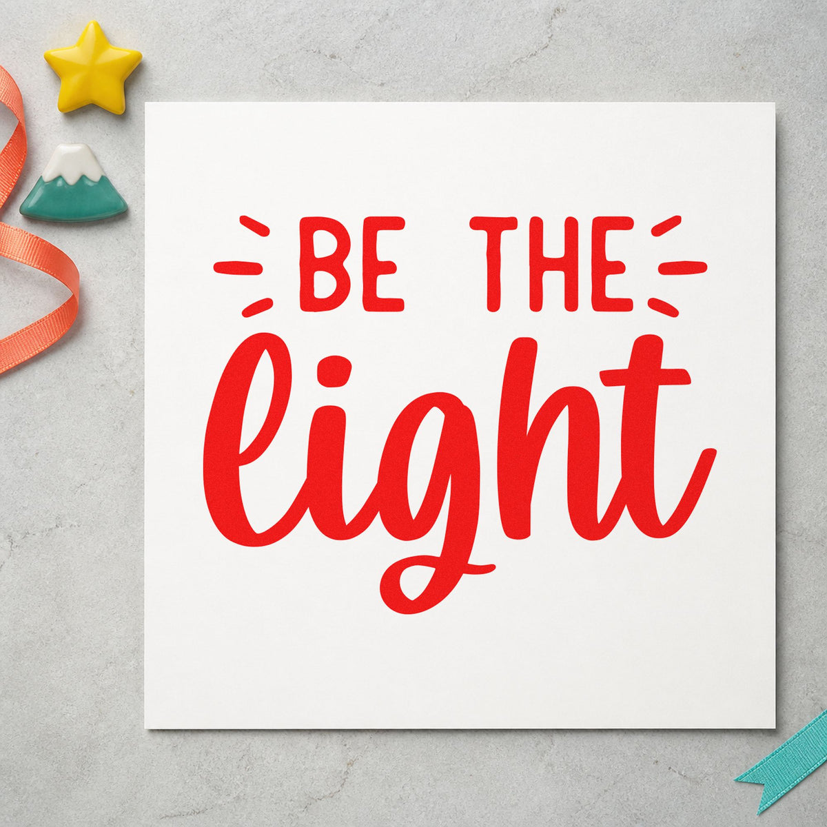 Be The Light Script rubber stamp shown in red ink, stamped for projects such as bin wax labels.