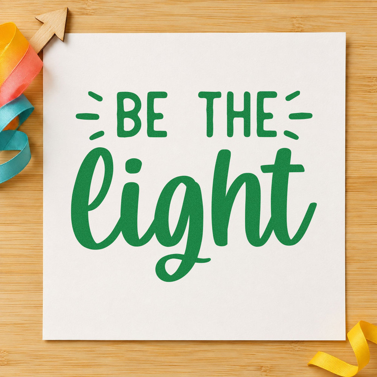 Be The Light Script craft stamp imprint in green ink on a handmade project, one idea being burn note cards.
