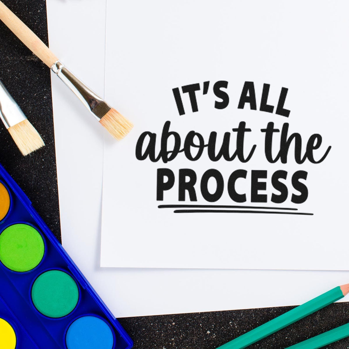 It's All About The Process Premium Wooden Stamp - Vintage Pro imprint stamped in black ink. The phrase "It's all about the process" combines bold capitals and script with underlines.