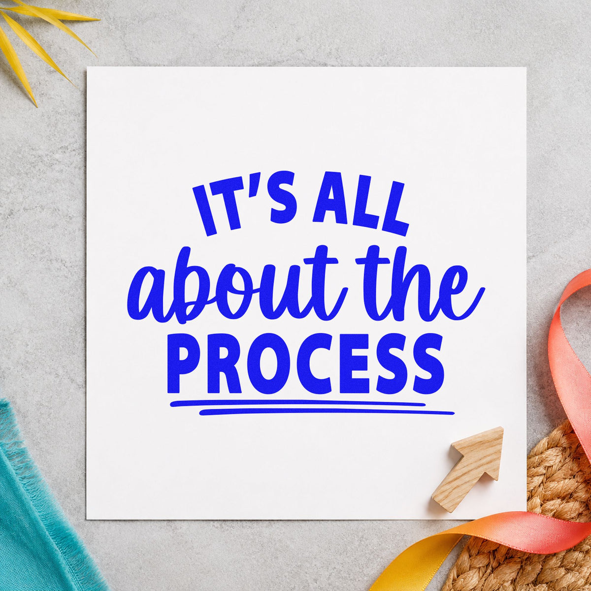 All About The Process craft stamp imprinted in blue ink on paper, a design suited to framed safelight wall.