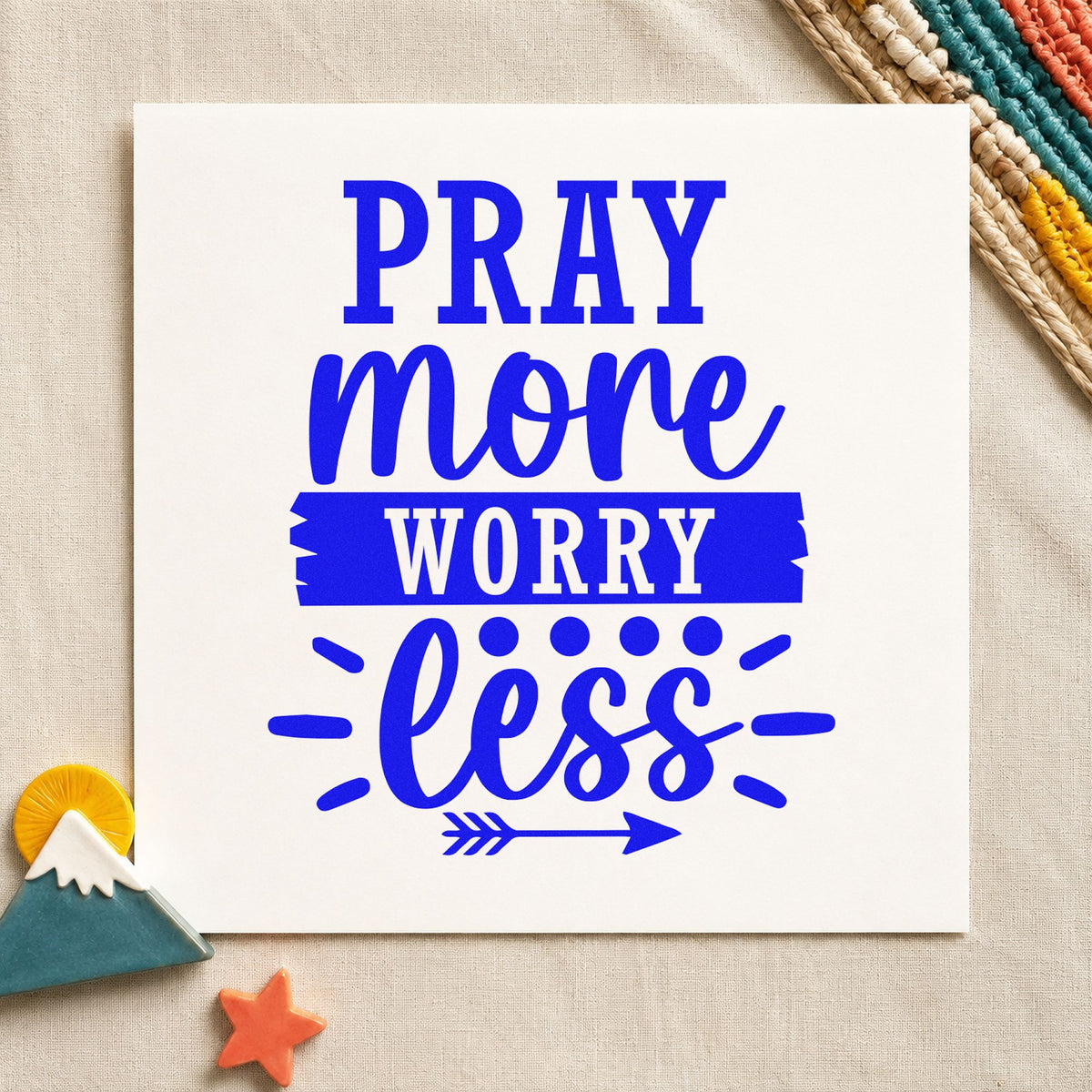 Pray More Worry Less craft stamp imprinted in blue ink on paper, a design suited to framed fellowship room.