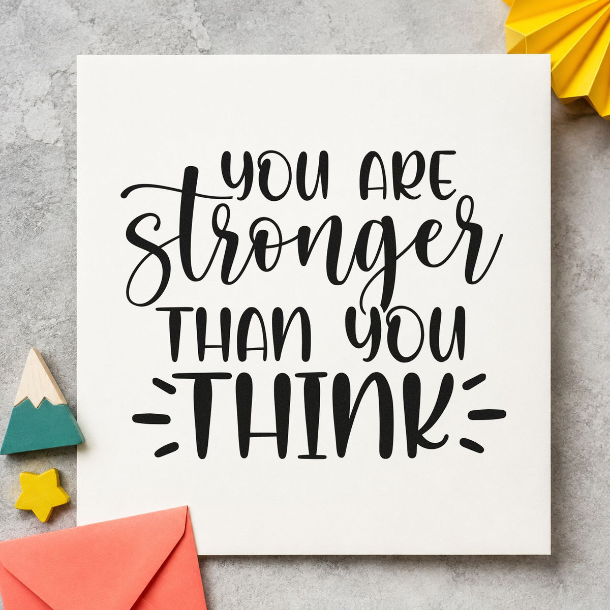 You Are Stronger Than Think craft stamp imprint in black ink on a handmade project, one idea being team kit gift tags.