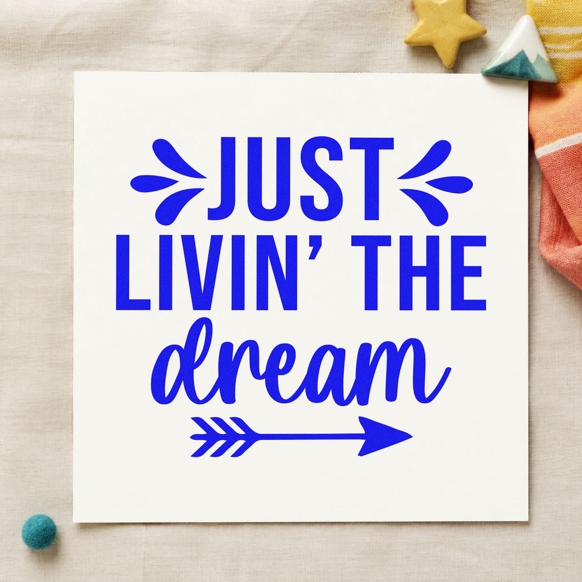 Just Livin The Dream craft stamp imprinted in blue ink on paper, a design suited to framed galley nook.