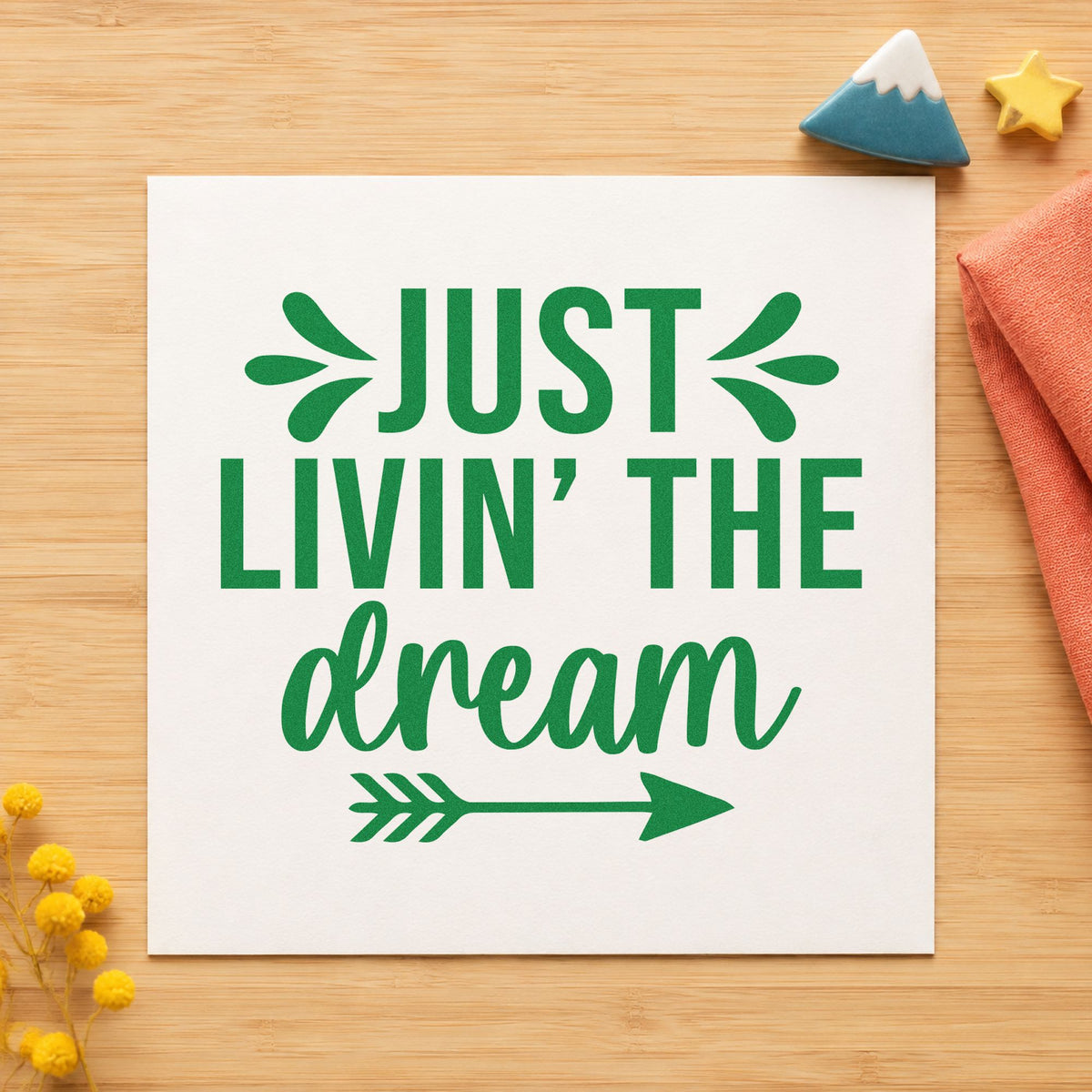 Just Livin The Dream craft stamp imprint in green ink on a handmade project, one idea being camp log cards.