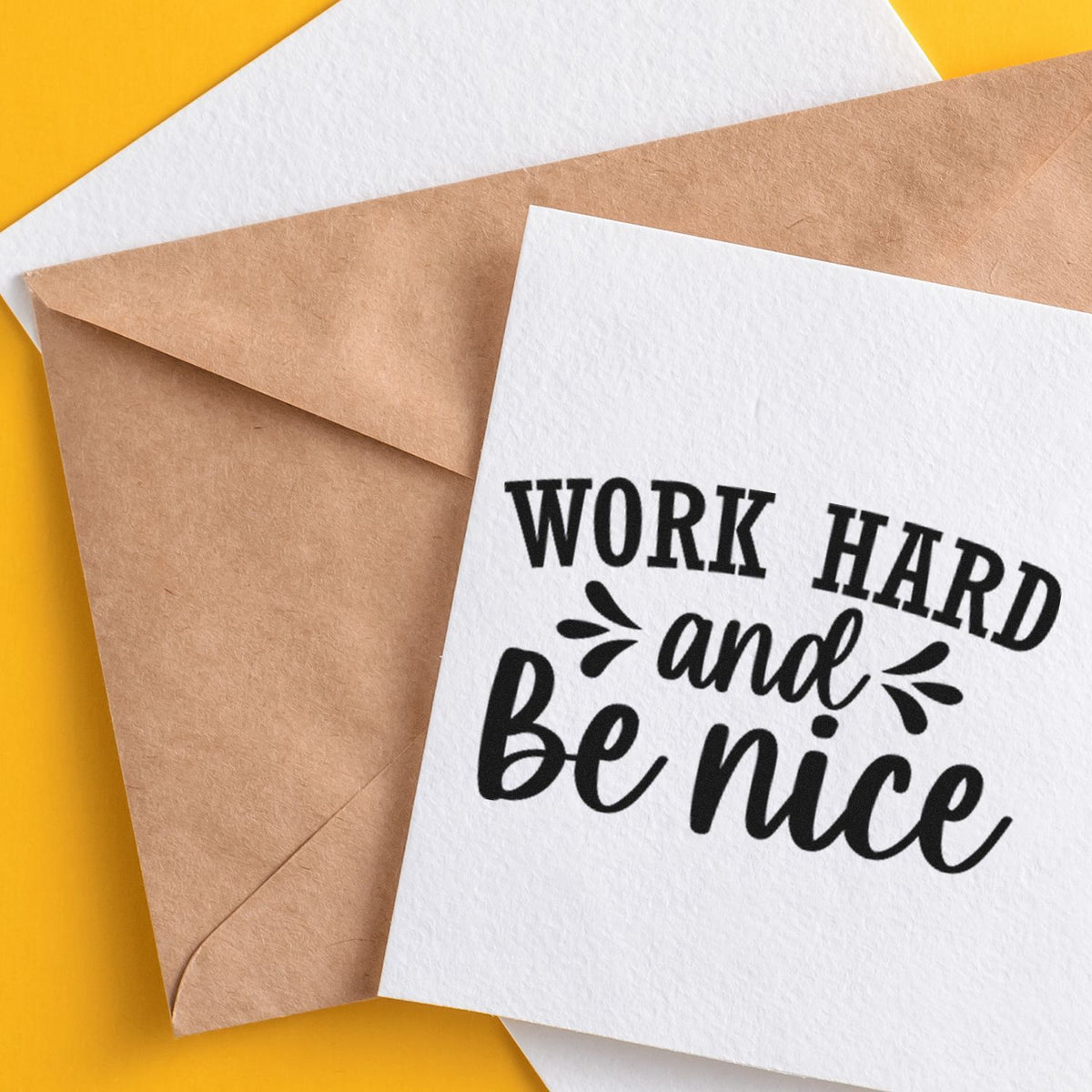 Work Hard And Be Nice Arch Stamp - Premium Vintage Pro Wooden imprint stamped in black ink. The words "Work hard and be nice" combine arched capitals and script with decorative splashes.