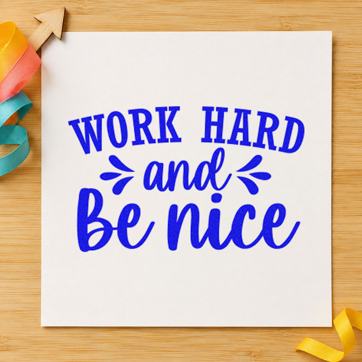 Work Hard And Be Nice craft stamp imprinted in blue ink on paper, a design suited to framed shop trailer.