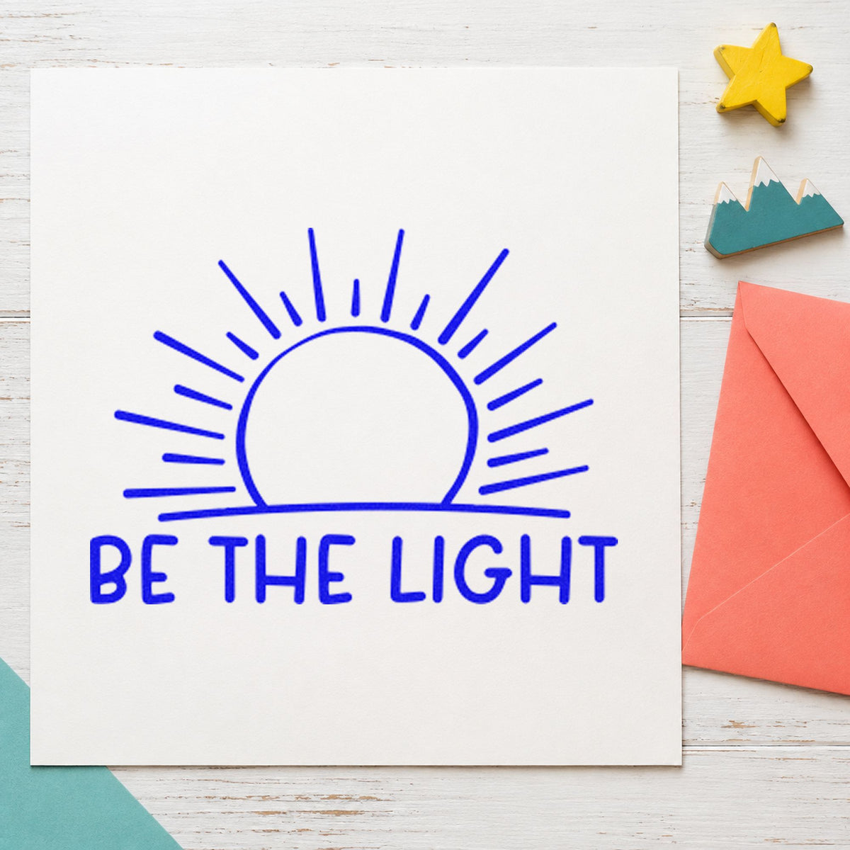 Be The Light Sunrise craft stamp in blue ink on cardstock, an easy option for buff band printing.
