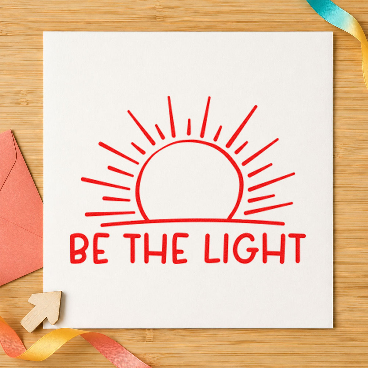 Be The Light Sunrise craft stamp imprint in red ink on a handmade project, one idea being route map cards.