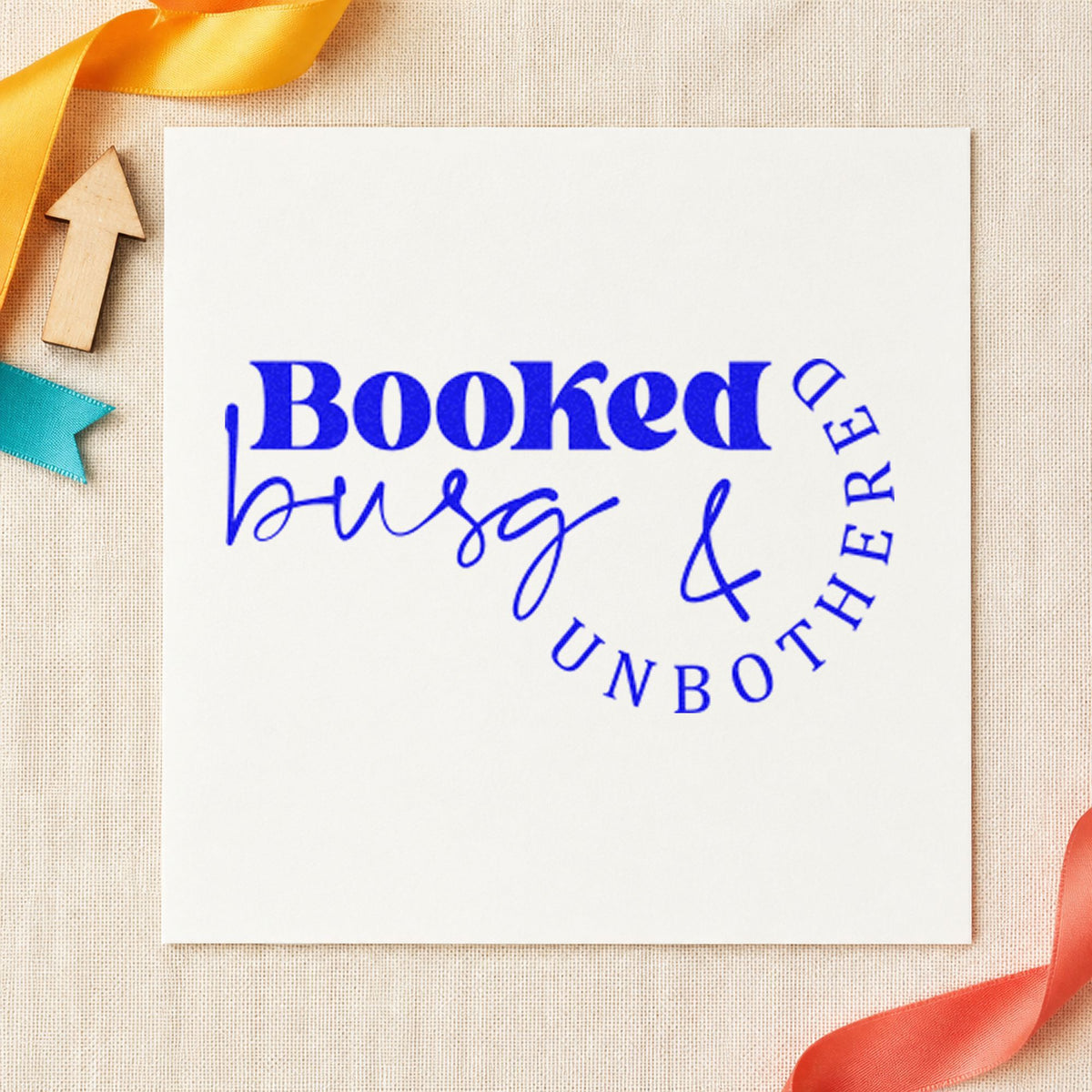 Booked Busy And Unbothered craft stamp in blue ink on cardstock, an easy option for station towel printing.