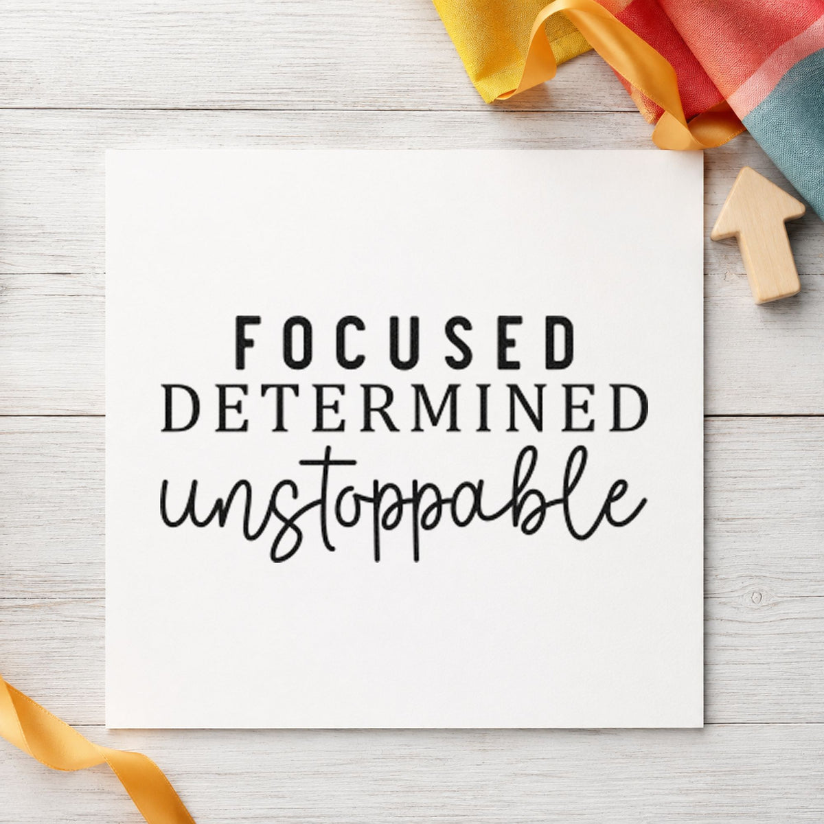 Focused Determined Unstoppable craft stamp imprint in black ink on a handmade project, one idea being client folder tags.