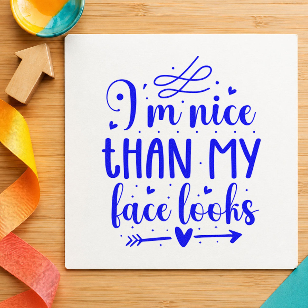 Nice Than My Face Looks craft stamp in blue ink on cardstock, an easy option for table skirt printing.