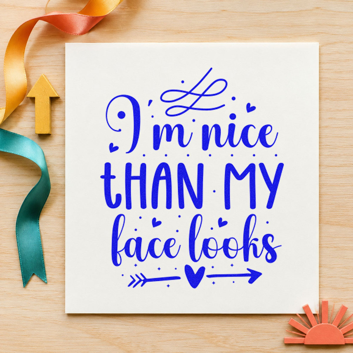 Nice Than My Face Looks craft stamp imprinted in blue ink on paper, a design suited to framed booth corner.