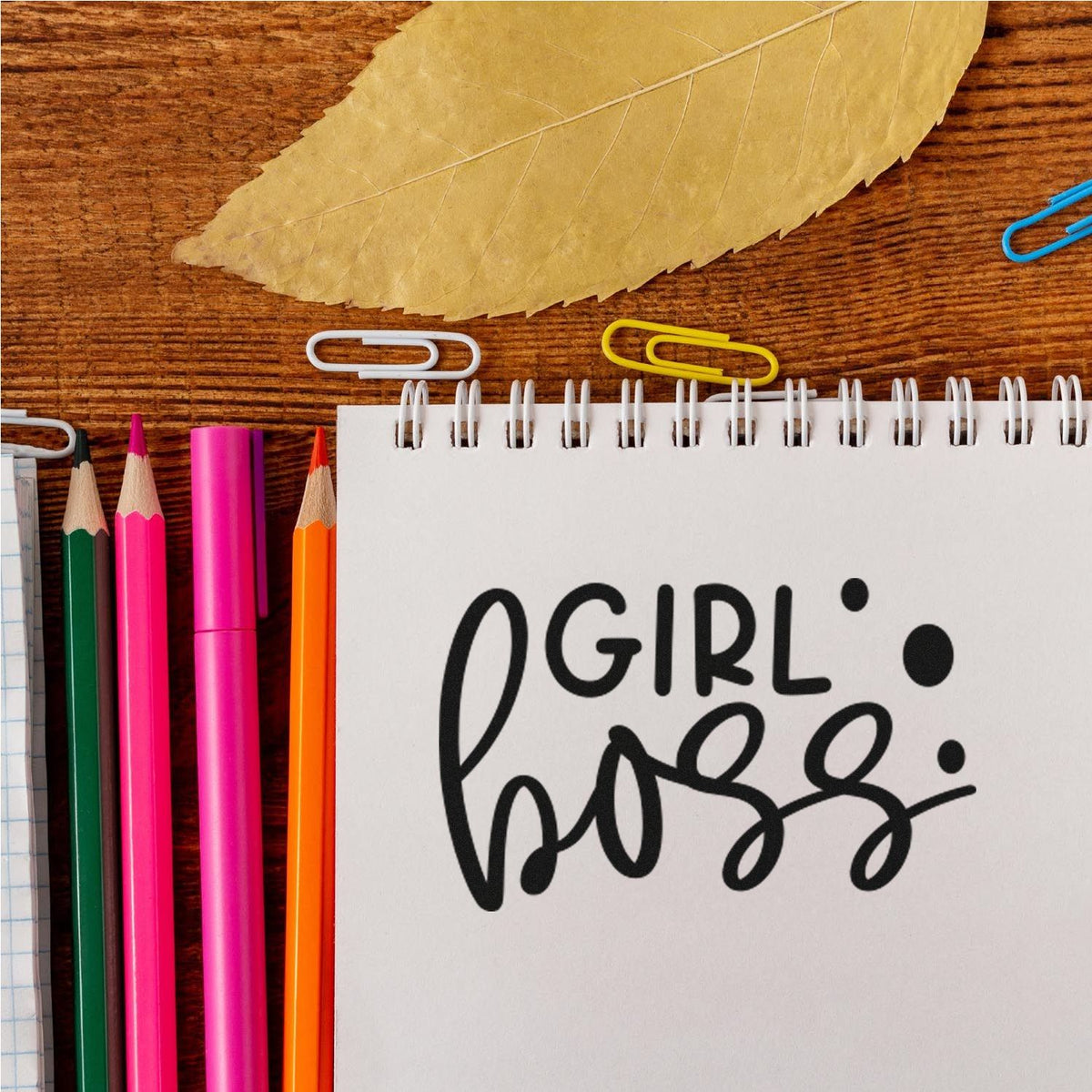 Premium Wooden Girl Boss Stamp - Vintage Pro imprint stamped in black ink. The words "Girl boss" appear in plain capitals and oversized brush script with solid dots.