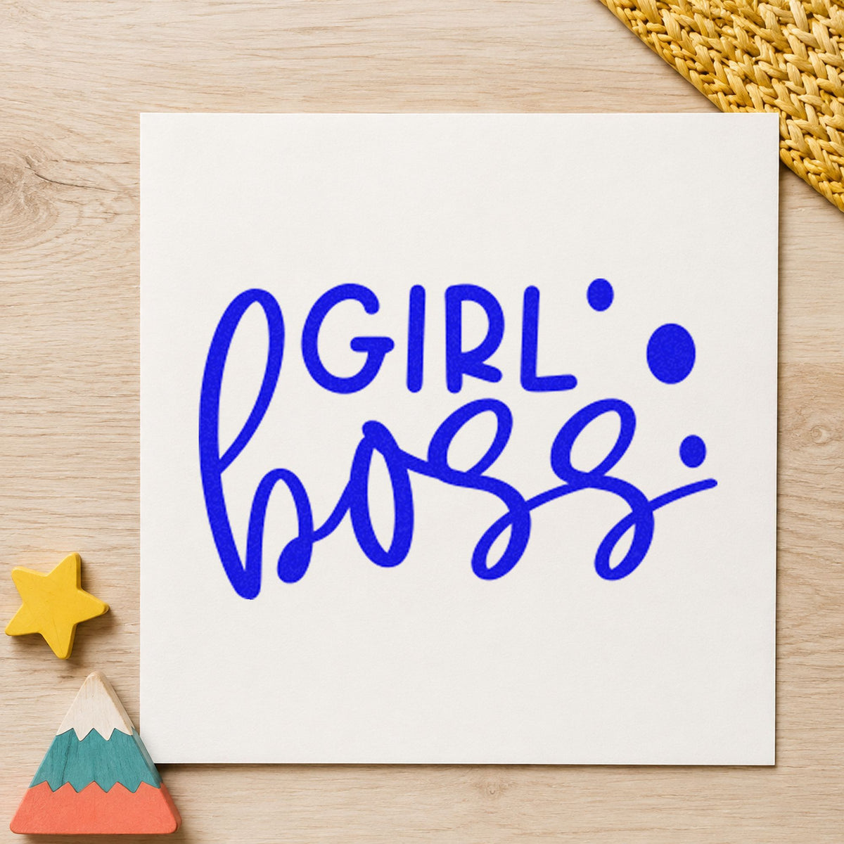 Girl Boss Bold Script craft stamp in blue ink on cardstock, an easy option for cleaning apron printing.