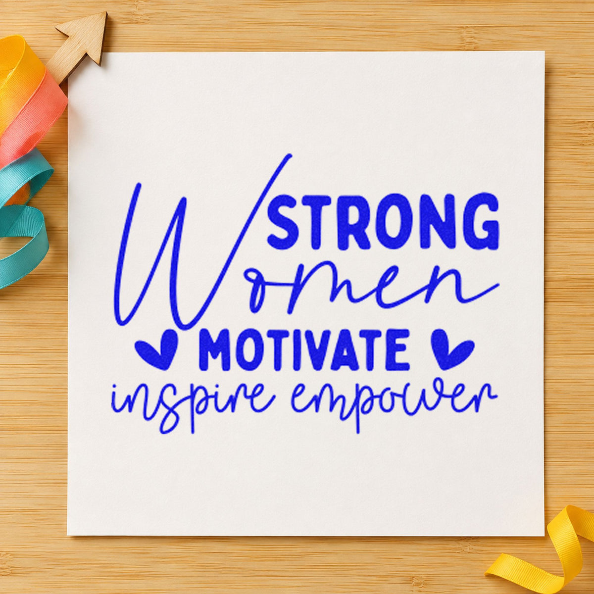 Strong Women Motivate Inspire craft stamp imprinted in blue ink on paper, a design suited to framed pack barn.