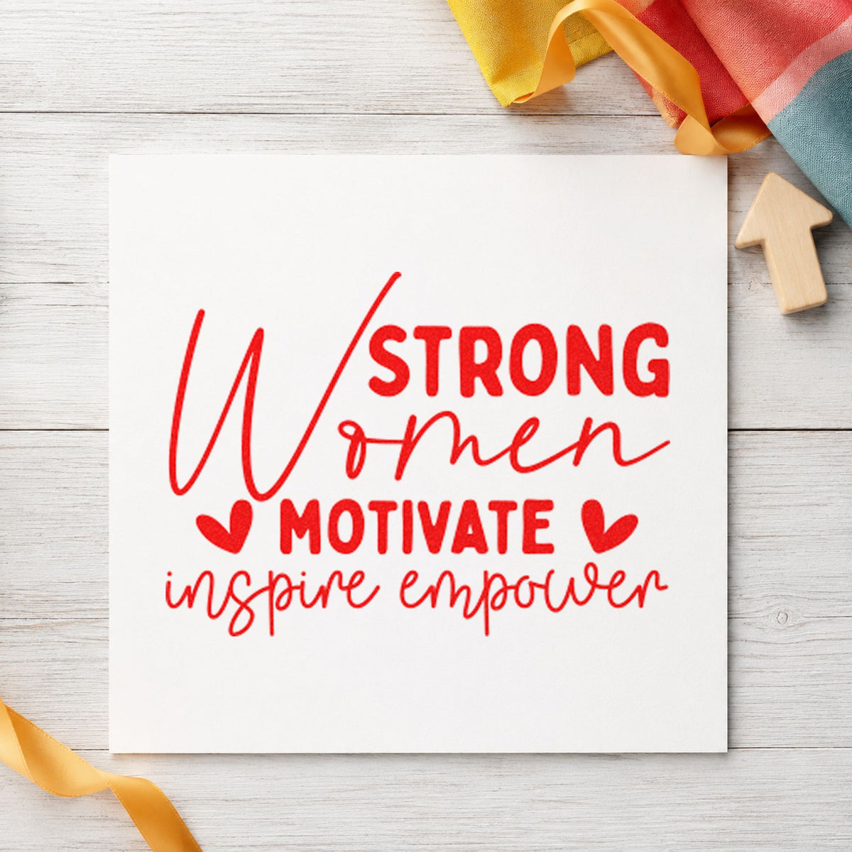 Strong Women Motivate Inspire craft stamp imprint in red ink on a handmade project, one idea being member recipe cards.