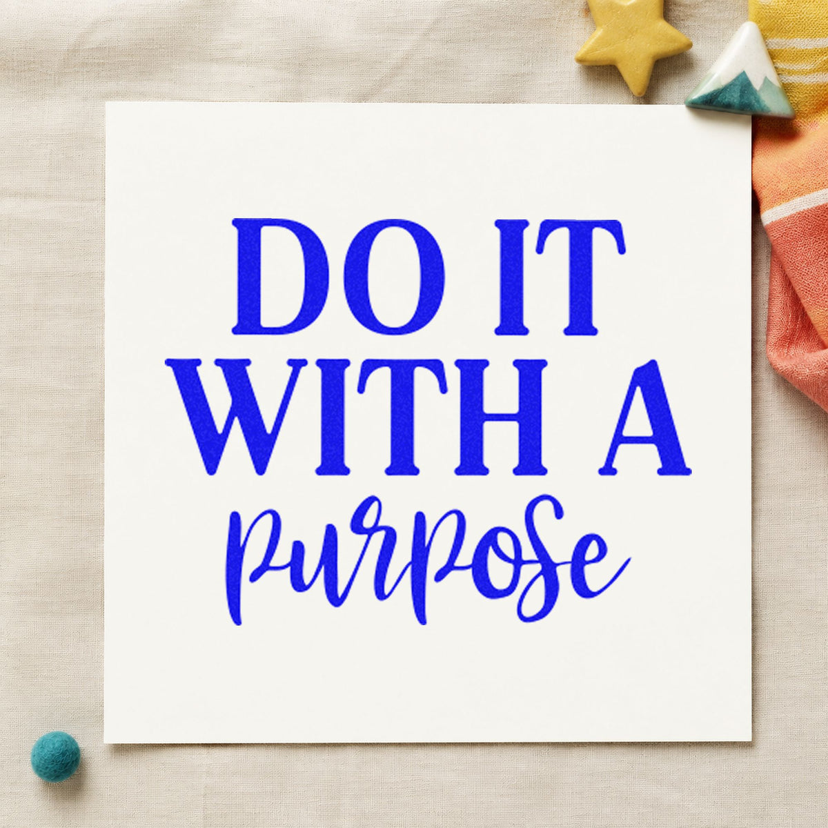Do It With A Purpose craft stamp in blue ink on cardstock, an easy option for crew cap printing.