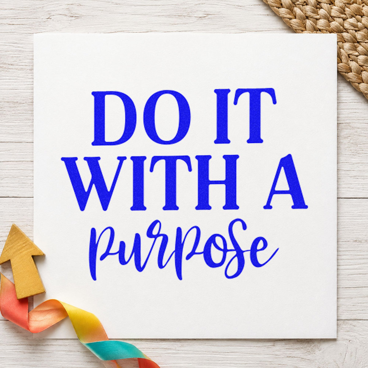 Do It With Purpose Script craft stamp imprinted in blue ink on paper, a design suited to framed club room.
