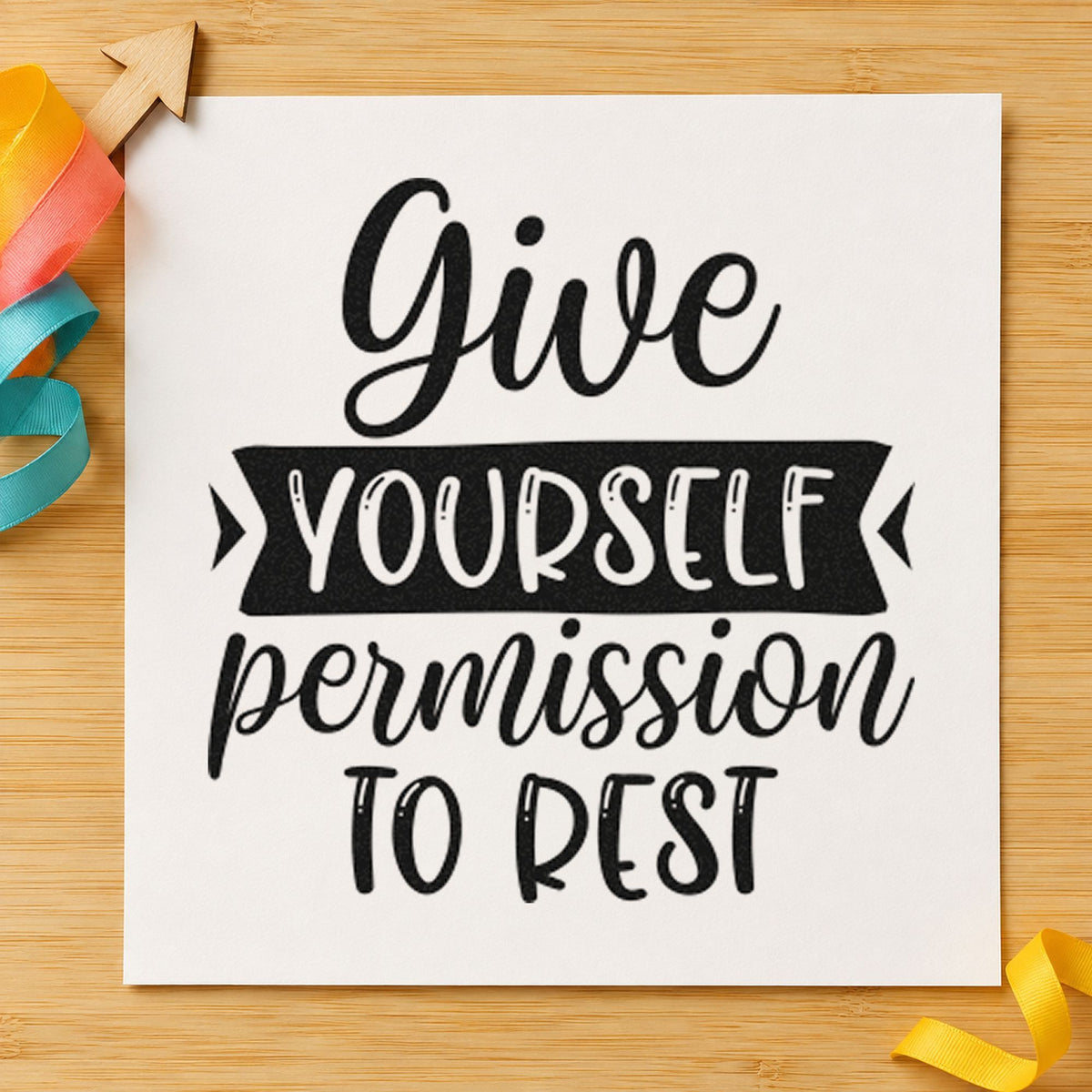 Give Yourself Permission To Rest craft stamp imprint in black ink on a handmade project, one idea being rest kit gift tags.