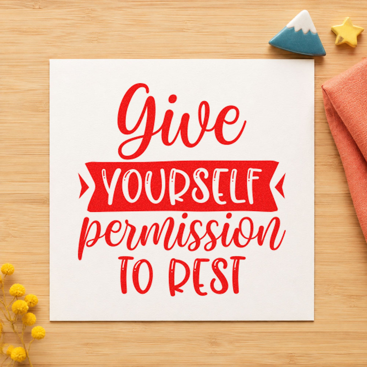 Give Yourself Permission To Rest craft stamp imprint in red ink on a handmade project, one idea being do nothing cards.