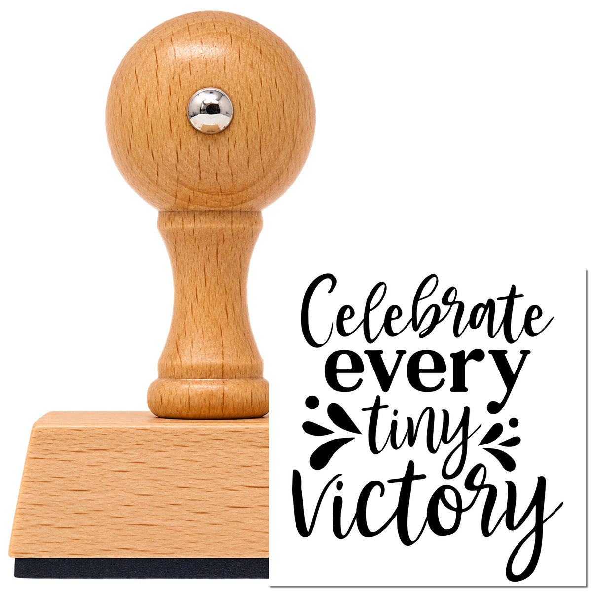 Celebrate Every Tiny Victory Lettering Vintage Pro rubber stamp in European beech wood with a round knob handle, shown beside its black imprint.