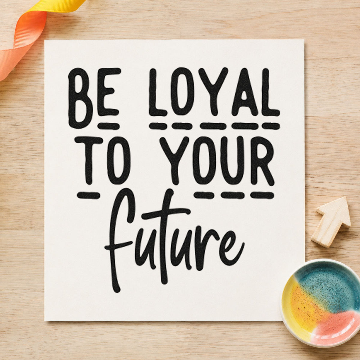 Be Loyal To Your Future craft stamp imprint in black ink on a handmade project, one idea being revision pack tags.