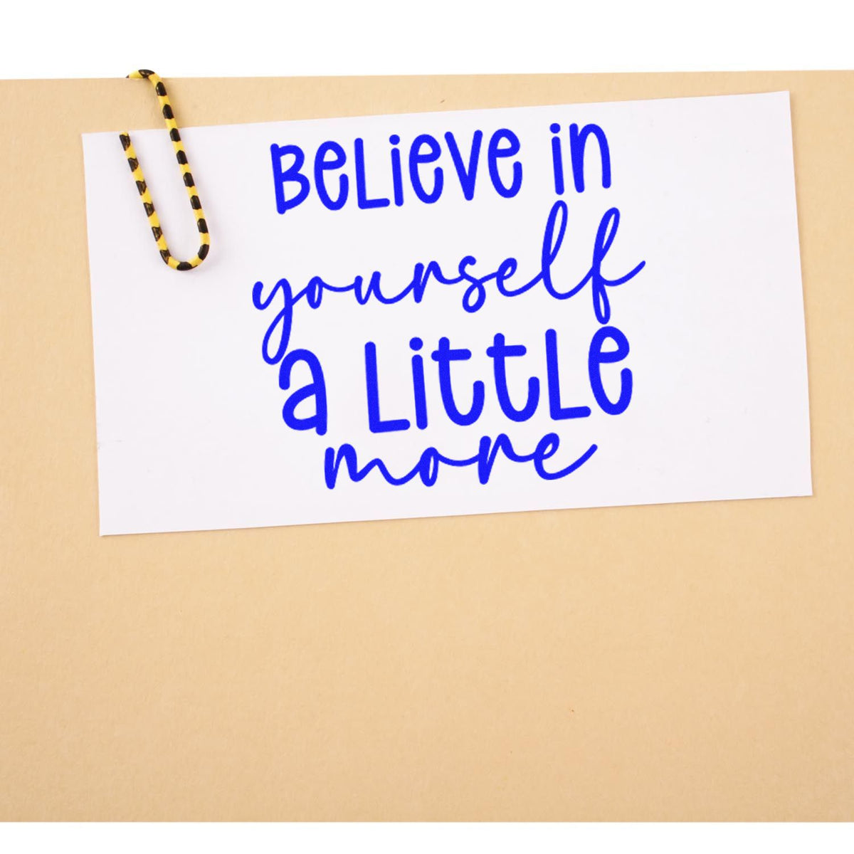 Believe Yourself A Little More rubber stamp shown in blue ink, stamped for projects such as speaking album page.