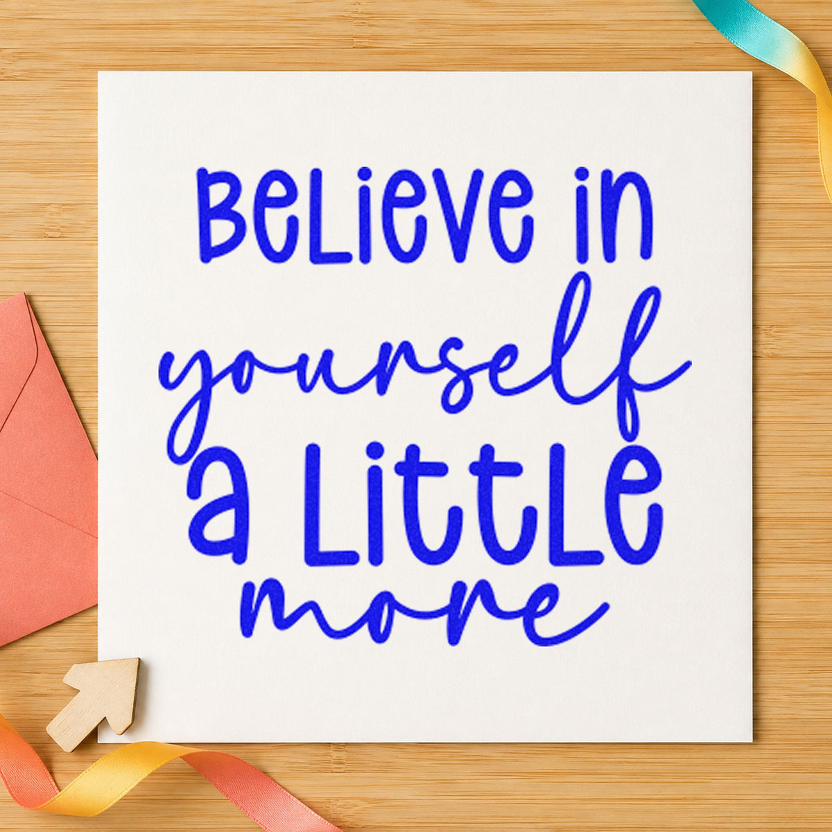 Believe Yourself A Little More craft stamp imprinted in blue ink on paper, a design suited to framed practice mirror.