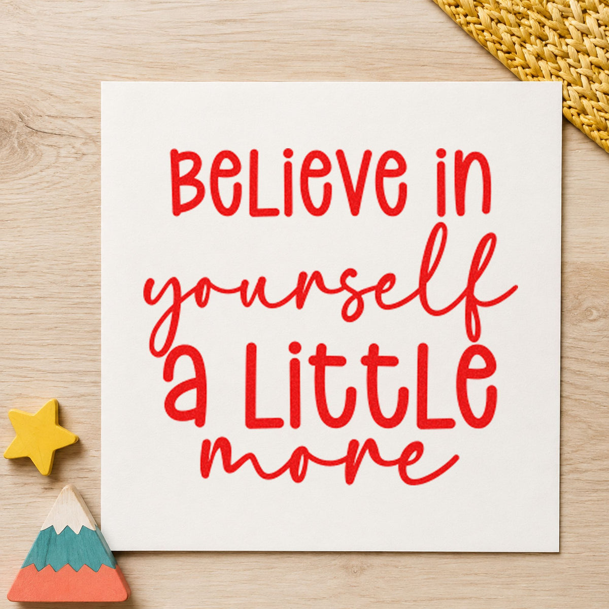 Believe Yourself A Little More rubber stamp shown in red ink, stamped for projects such as bin handout labels.