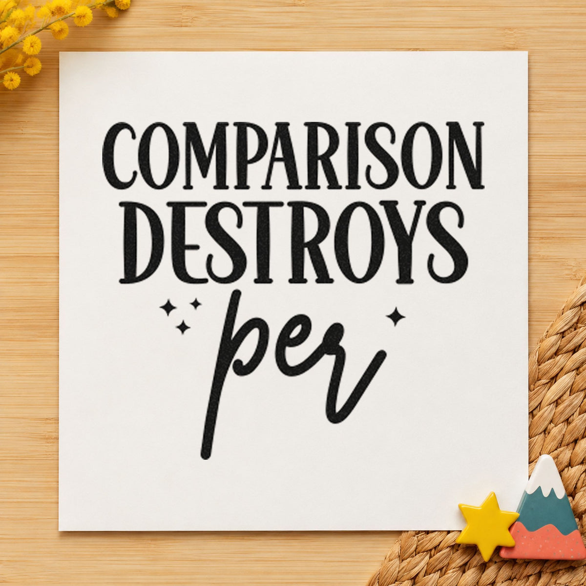 Comparison Destroys Per Lettering craft stamp imprint in black ink on a handmade project, one idea being fabric bundle tags.