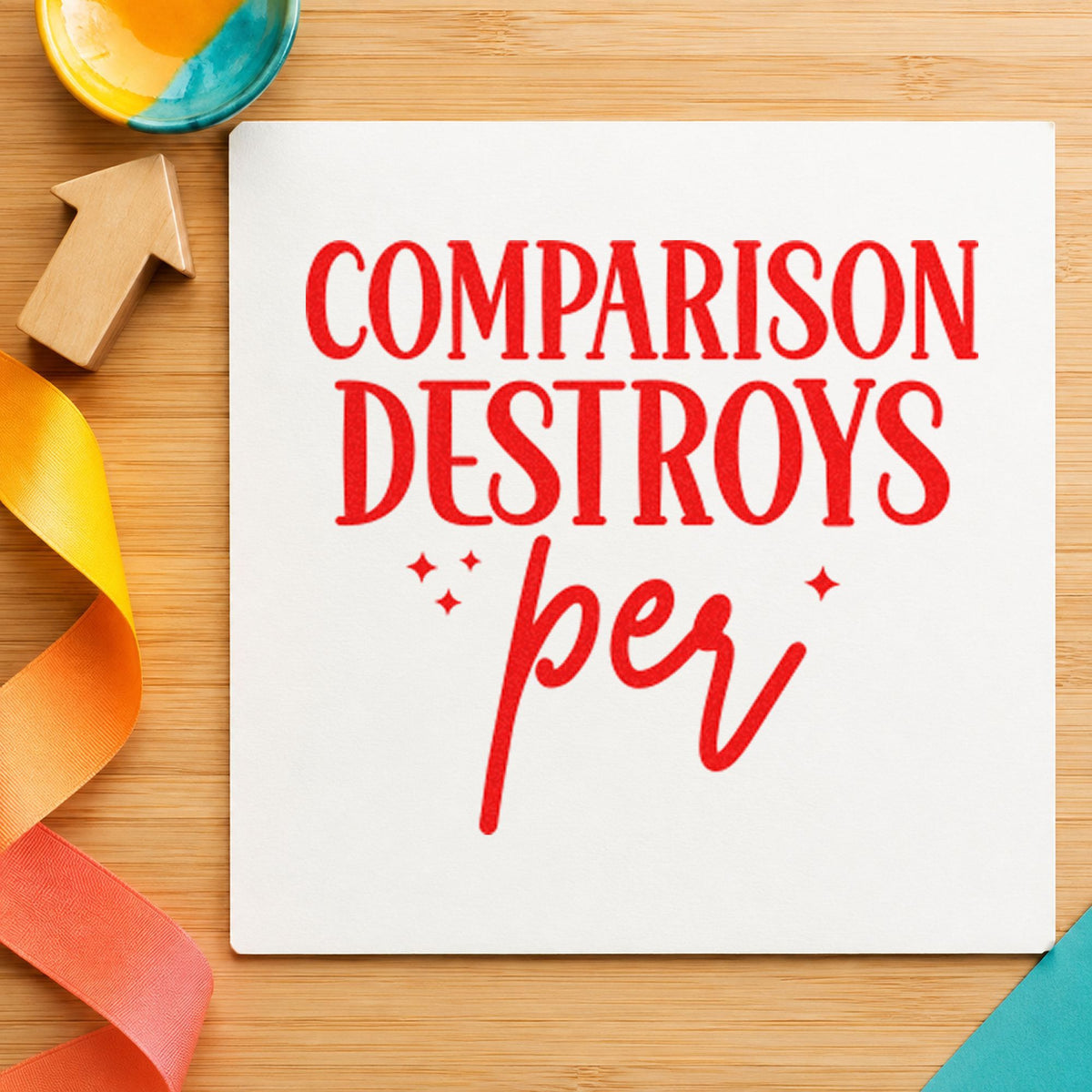 Comparison Destroys Per Lettering craft stamp imprint in red ink on a handmade project, one idea being seam guide cards.