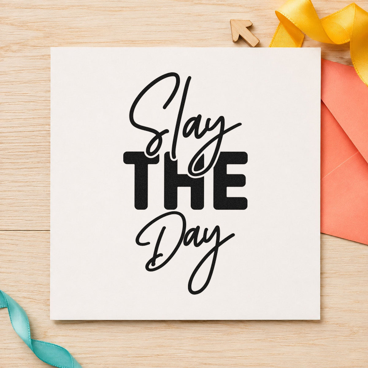 Slay The Day craft stamp imprint in black ink on a handmade project, one idea being class prize gift tags.