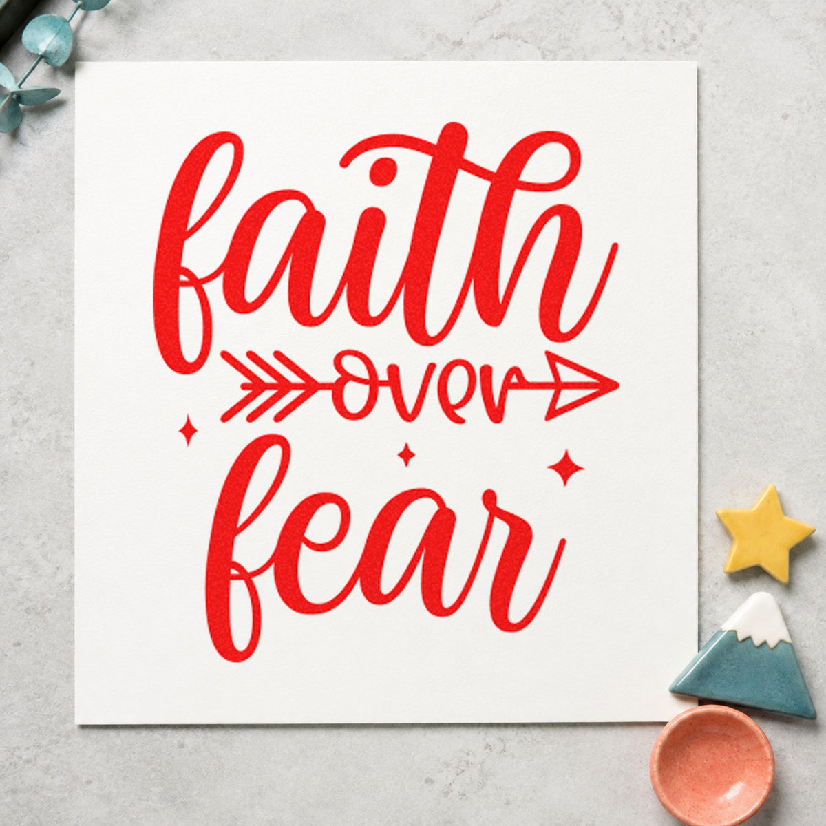Faith Over Fear Arrow craft stamp imprint in red ink on a handmade project, one idea being daily note cards.
