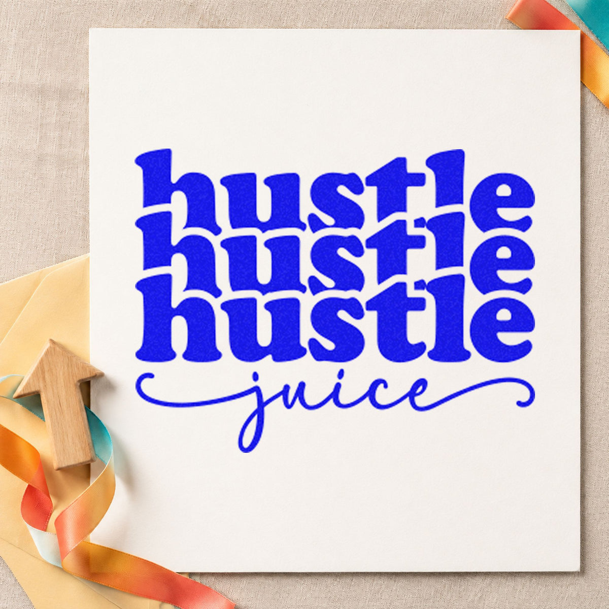 Hustle Juice Repeated Lettering craft stamp imprinted in blue ink on paper, a design suited to framed cupping table.