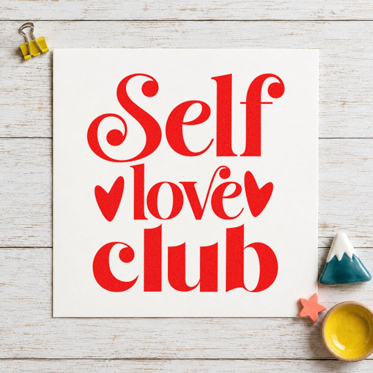 Self Love Club Hearts craft stamp imprint in red ink on a handmade project, one idea being evening idea cards.