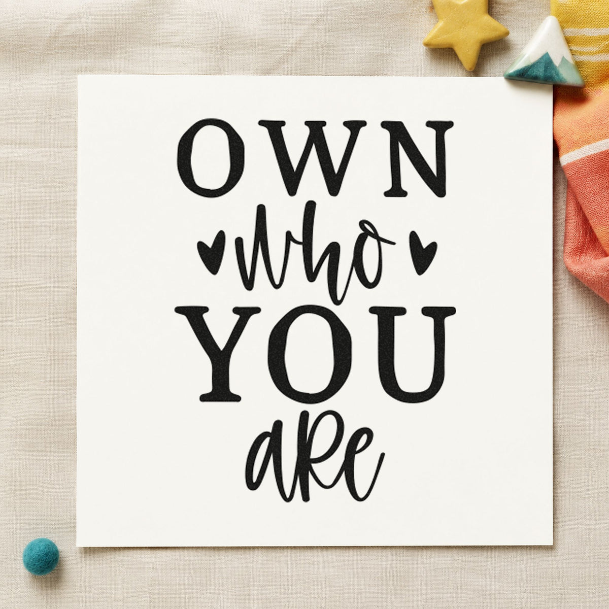 Own Who You Are craft stamp imprint in black ink on a handmade project, one idea being skate rental tags.
