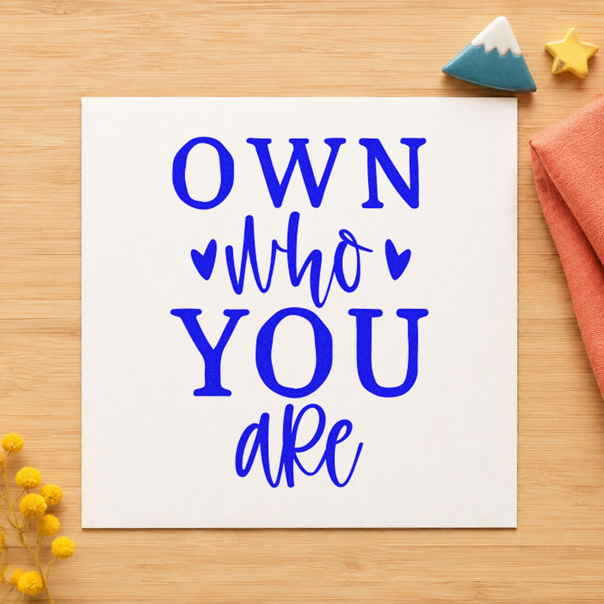 Own Who You Are craft stamp in blue ink on cardstock, an easy option for rink banner printing.