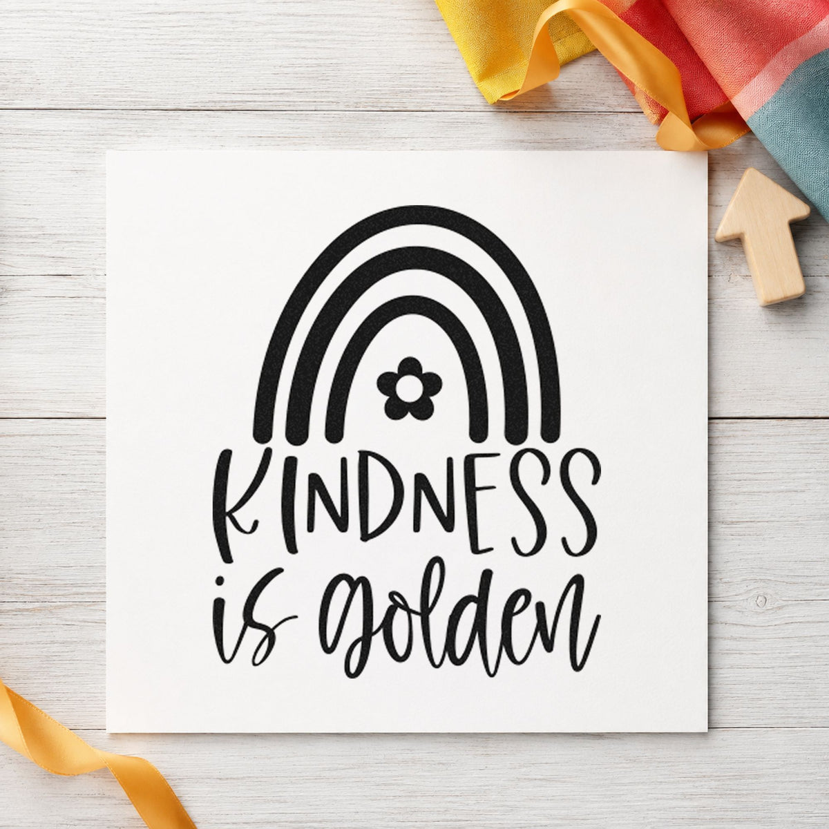 Kindness Is Golden Rainbow craft stamp imprint in black ink on a handmade project, one idea being warm drink gift tags.