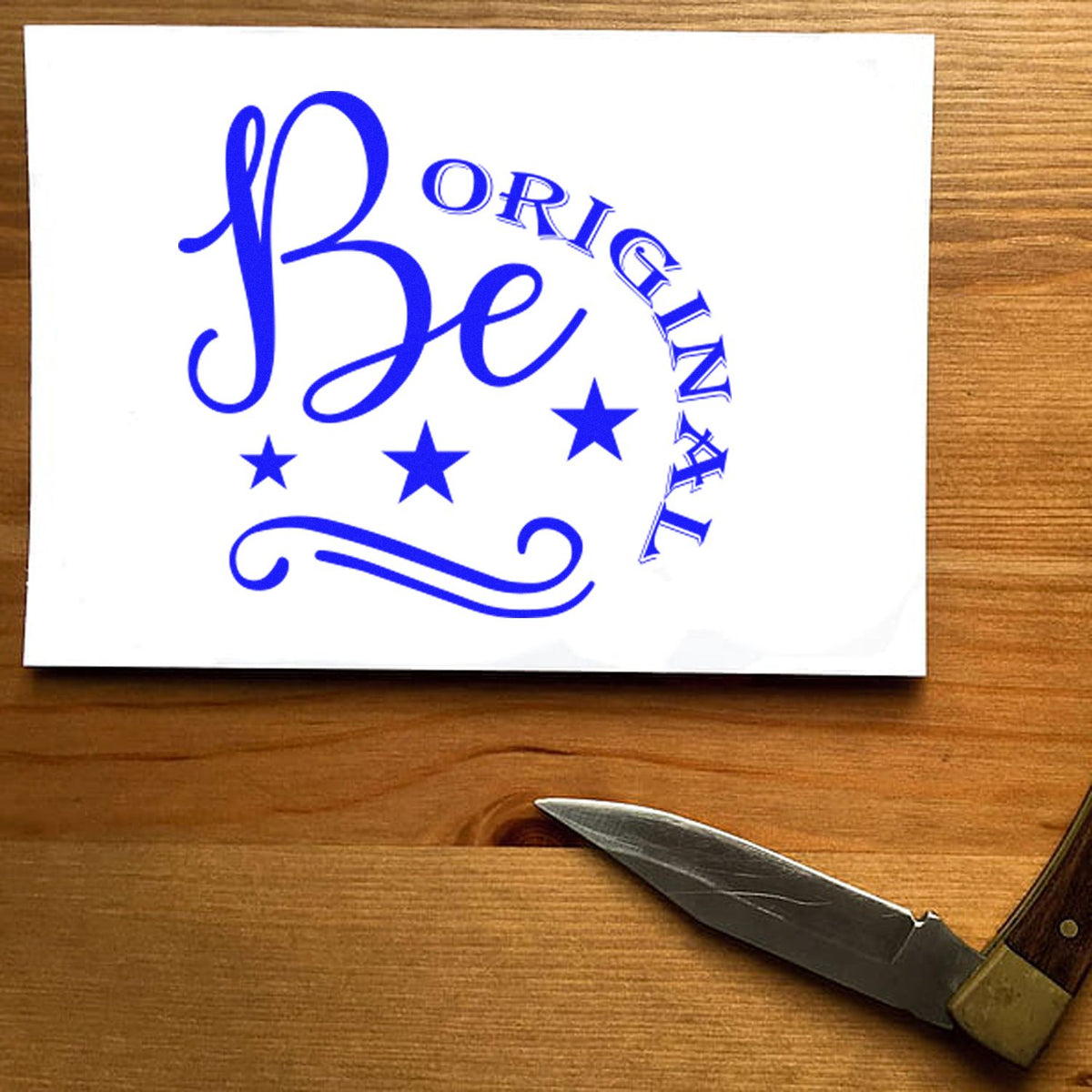 Be Original Stars Flourish rubber stamp shown in brown ink, stamped for projects such as custom album page.