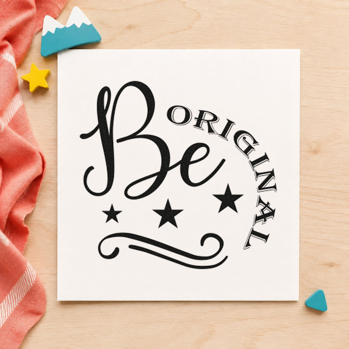 Be Original Stars Flourish craft stamp imprint in black ink on a handmade project, one idea being shoe box gift tags.