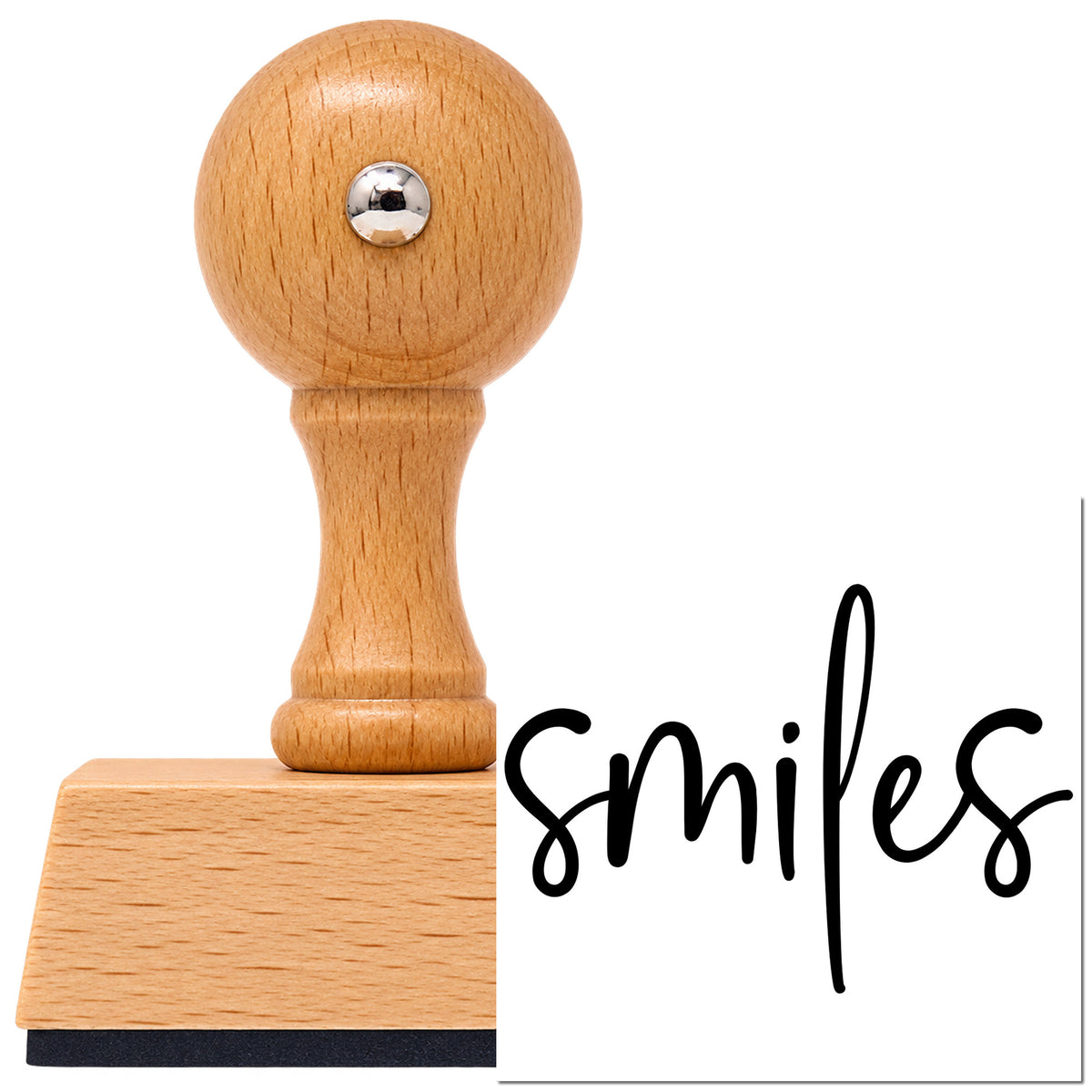 Smiles Simple Brush Script Lettering Vintage Pro rubber stamp in European beech wood with a round knob handle, shown beside its black imprint.