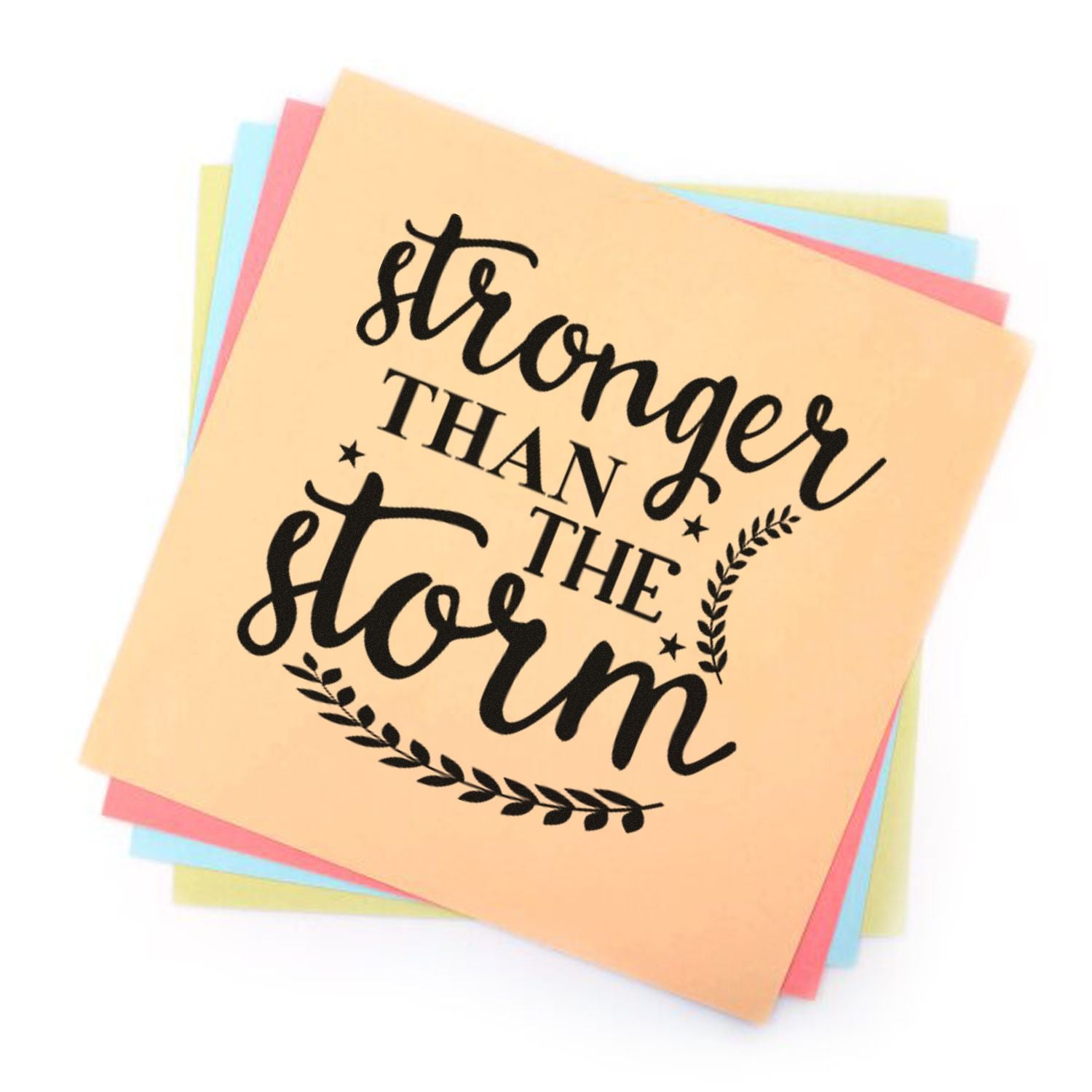 Inspirational rubber stamp design reading Stronger Than the Storm with leafy accents on pastel paper for encouragement crafts.