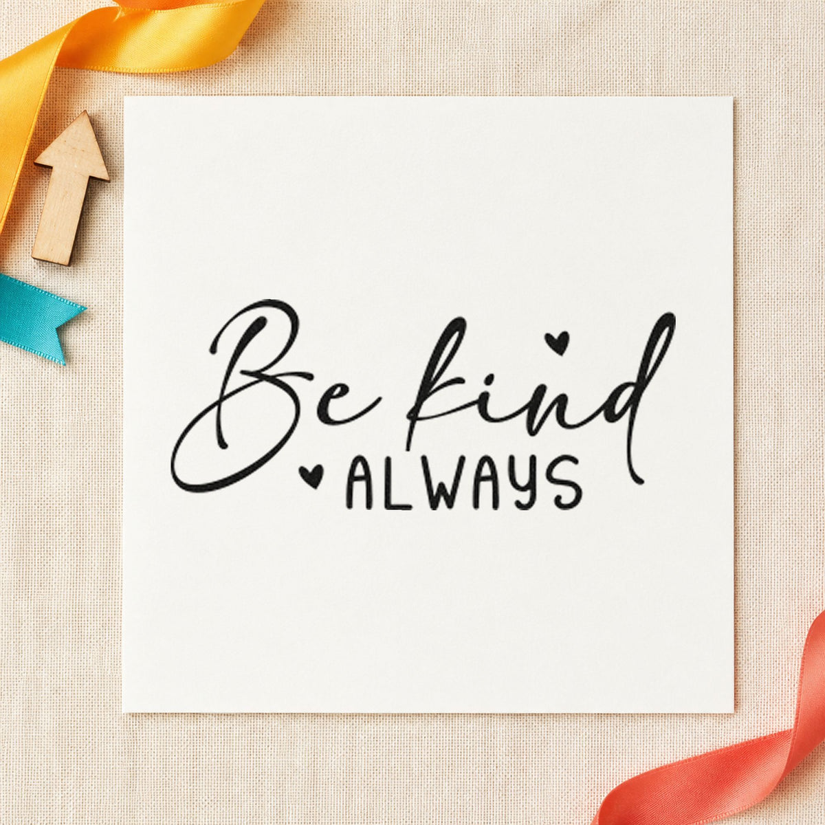Be Kind Always Heart craft stamp imprint in black ink on a handmade project, one idea being book bundle tags.