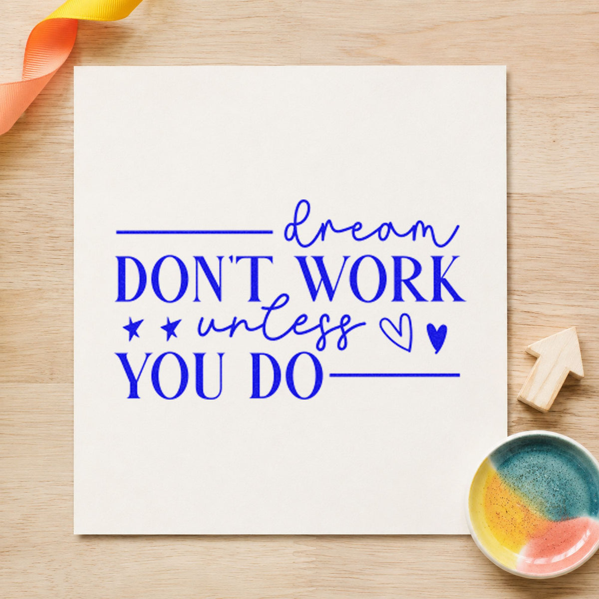 Dream Don't Work Unless You craft stamp in blue ink on cardstock, an easy option for head cover printing.