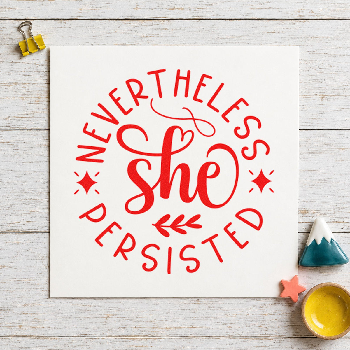 Nevertheless She Persisted Circle rubber stamp shown in red ink, stamped for projects such as shelf month labels.