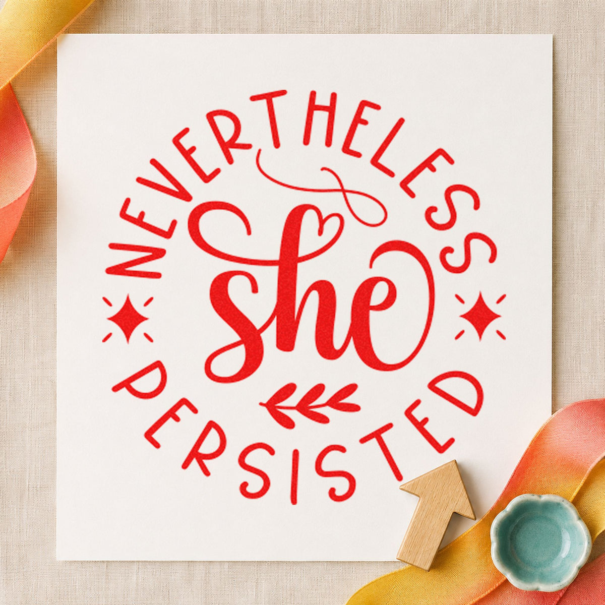 Nevertheless She Persisted Circle craft stamp imprint in red ink on a handmade project, one idea being discussion cards.