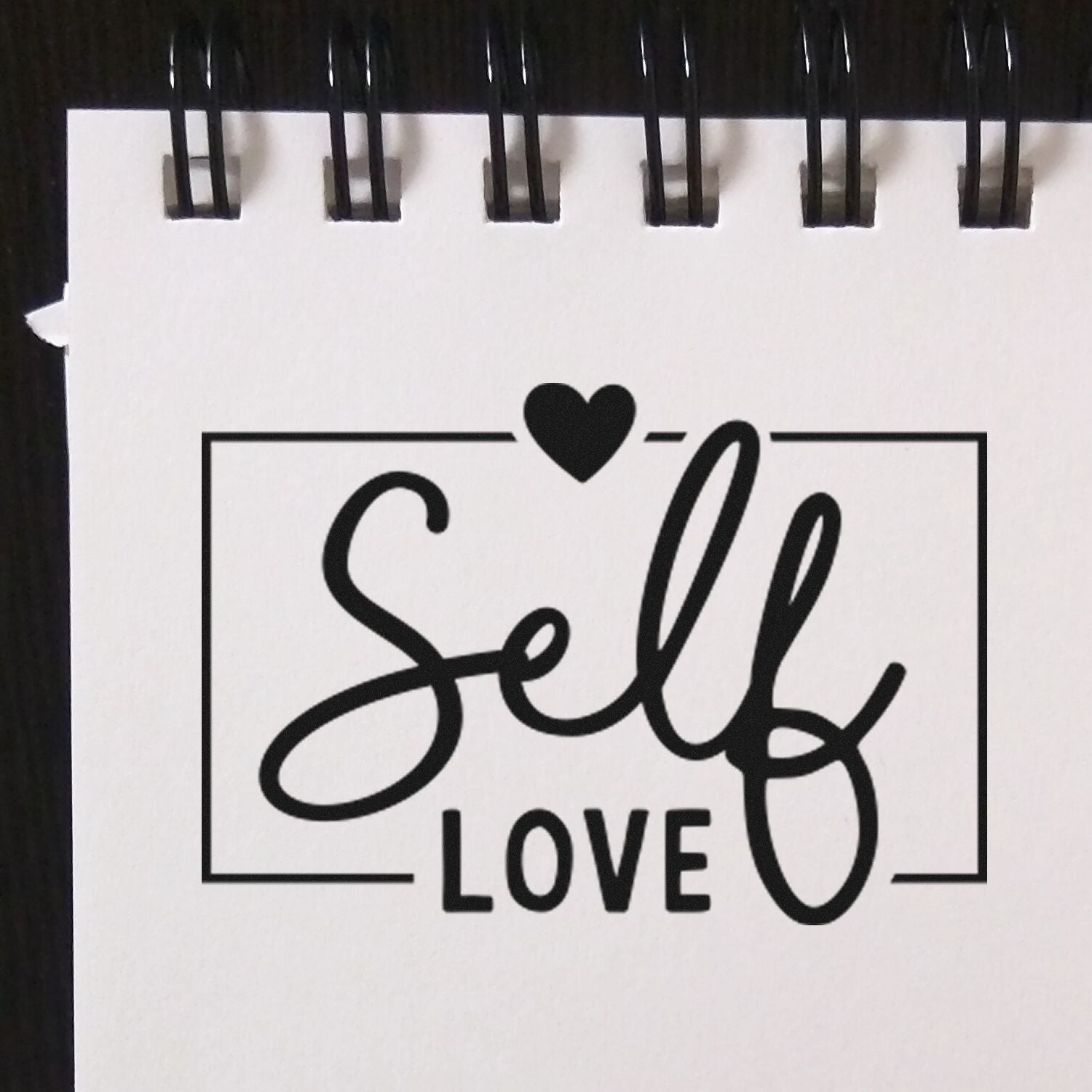 Self Love rubber stamp design with heart, ideal for journaling, planners, and handmade craft projects.
